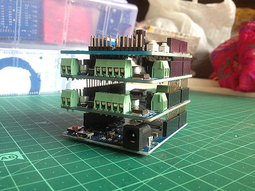 A stack of Arduino boards
