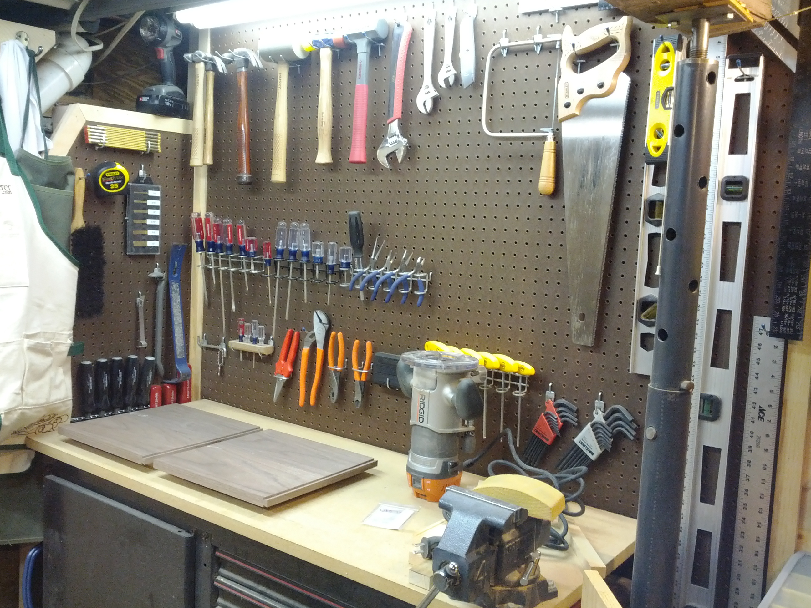 A woodshop with a pegboard full of tools like mallets, wrenches, saws, and levels
https://thewoodlab.net/tag/workshop/
 © 2009-2025 by Jim Ashley is licensed under CC BY-NC-ND 4.0
 